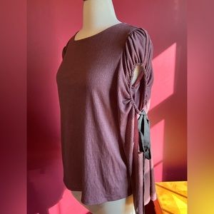 Express mauve top with cut outs on sleeves that tie sz S